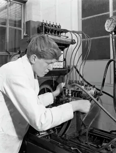 Apprentice at work, Globe & Simpson auto electrical workshop, Nottingham, Nottinghamshire, 1961