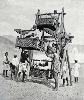 Arabian children enjoying a big-wheel, 1922