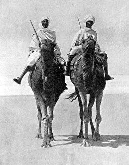 Two Arabs riding camels in the Sahara Desert, Africa, 1936.Artist: Fox Photos