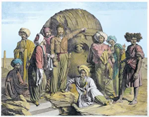 Archaeologist Prints: Archaeologist Bernardino Drovetti measuring a colossal head in the Egyptian desert, 1819