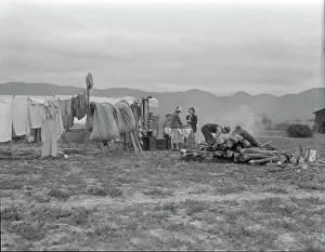 Refugee Camp Prints: Arkansas family washing dishes, seven months in California, 1936. Creator: Dorothea Lange