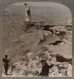Crag Prints: The Arno. Dragoman standing on rock, c1900