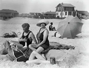 Arnold Genthe with two women friends in Long Beach, New York, between 1911 and 1942. Creator: Arnold Genthe