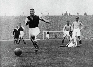 Images Dated 5th May 2010: Arsenal footballer Alex James passes three Manchester City players, c1929-c1937