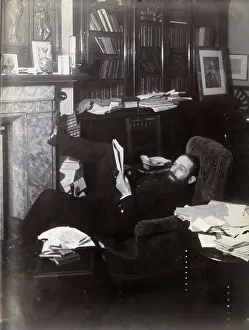 1901 Prints: Arthur Schuster, lying on an armchair by a fireplace