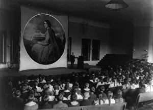 Auditorium Prints: An Assembly in the auditorium for a lecture with slides on art