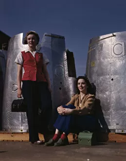 Women At Work Collection: Two assembly line workers at the Long Beach, Calif. plant of Douglas Aircraft Company... 1942