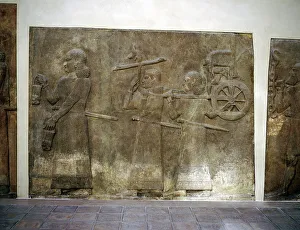 Assyrian relief showing servants carrying the Kings chariot, Khorsabad, c8th century BC