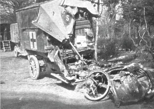 Shelling Prints: Au Volant; Auto sanitaire don't l'avant a ete broye; des volontaires de la S