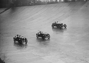 Barc Prints: Two Austin 7s and an unidentified car racing at a BARC meeting, Brooklands, Surrey