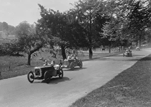 Castle Donington Gallery: Austin Ulster leading a MG Magnette at Donington Park, Leicestershire, 1930s. Artist: Bill Brunell