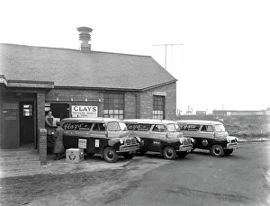 Austin vans being loaded outside Clays TV repair depot, Mexborough, South Yorkshire, 1959