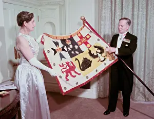 Swan Prints: The Australian High Commissioner to Britain and his wife holding the standard of Australia
