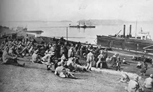 Danube Gallery: Austrian prisoners taken by Serbians resting at mid-day on the banks of the Danube, 1915