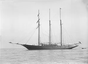 Tall Ship Prints: The auxiliary schooner La Cigale at anchor, 1913. Creator: Kirk & Sons of Cowes