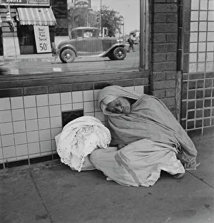 Bus Stop Prints: She awaits the international streetcar at a corner in El Paso