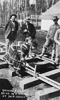 Creek Prints: Babe White driving first spike in U.S. Railroad, between c1900 and c1930. Creator: Unknown