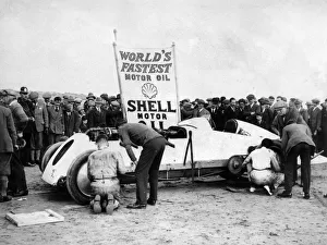 Shell Prints: BABS with Parry Thomas, having wheel changed at Pendine sands 1926. Creator: Unknown