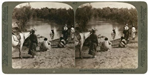 Baptising Gallery: Baptising in the River Jordan, Palestine, 1903.Artist: Underwood & Underwood
