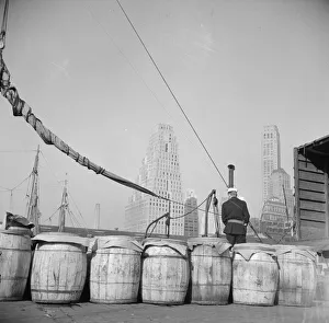 Barrels of fish on the docks at Fulton fish market ready to be shipped to... New York, 1943. Creator: Gordon Parks