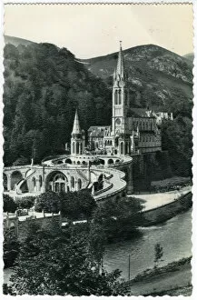 Images Dated 21st June 2021: Basilica and River Gave, Lourdes, 1930s. Creator: Unknown
