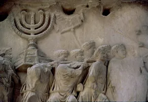 Basrelief in the Arch of Titus representing men carrying a menorah, located in