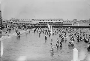Sunbathing Prints: Bathing at Brighton Beach, between c1910 and c1915. Creator: Bain News Service