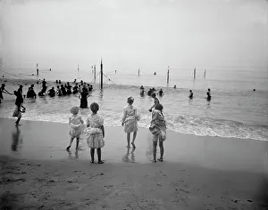 Holidaymakers Prints: On the beach, between 1900 and 1910. Creator: Unknown