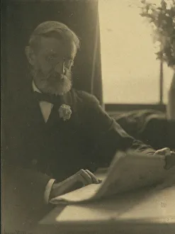 Platinum Prints 1900 Gmgpc Prints: Bearded man in spectacles reading a newspaper, c1900. Creator: Anne K Pilsbury