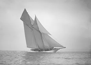 The beautiful schooner Cetonia making good headway, 1911. Creator: Kirk & Sons of Cowes