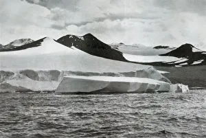Desolate Prints: A Berg Calving from a Glacier at Cape Crozier, c1911, (1913). Artist: Herbert Ponting