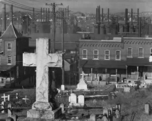 Rooftops Gallery: Bethlehem graveyard and steel mill, Pennsylvania, 1935. Creator: Walker Evans