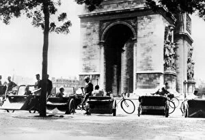 Cabbie Gallery: Bicycle taxis in the Place d Etoile by the Arc de Triomphe, German-occupied Paris, August 1943