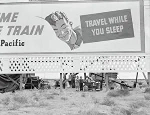 Camping Out Prints: Billboard along U.S. 99 behind which three destitute families