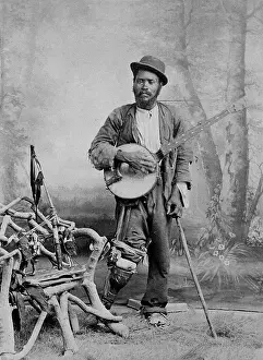 Ragged Prints: A black banjo player with a wooden leg, c1865. Creator: Unknown