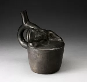 Blackware Handle Spout Vessel with Relief of a Reclining Musician with Pipes, 100 B.C./A