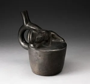 Mochica Prints: Blackware Handle Spout Vessel with Relief of a Reclining Musician with Pipes