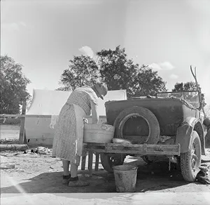 Housework Prints: Blue Monday in a California migratory camp, 1936. Creator: Dorothea Lange