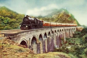 Between Bombay and Delhi. A striking view of the Frontier Mail passing over a viaduct Between Bombay and Delhi. A striking view of the Frontier Mail passing over a viaduct