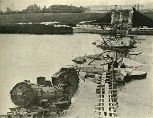 Bombed bridge and derailed train, northern France, First World War, 1914, (c1920)