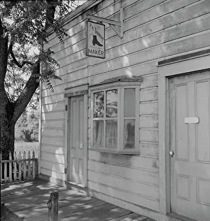 Shoemakers Prints: Boot and shoemaker shop in small California town, 1938. Creator: Dorothea Lange