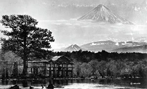 Booths on the river bank against the backdrop of Klyuchevsky volcano, 1922-1923. Creator: Rene Malaise