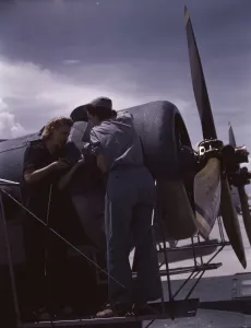 Aeronautics Gallery: Bowen and Olsen, a riveter and her supervisor, in the...Naval Air Base, Corpus Christi, Texas, 1942