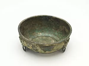 Bronze With Gilding Collection: Bowl with masks and ring handles, Han dynasty, 206 BCE-220 CE. Creator: Unknown