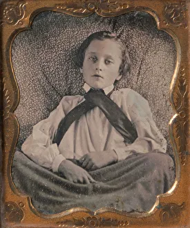 Boy Seated Cross-legged, Partially Covered by Blanket, Leaning Against Cushion, 1850s