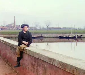 Sea Wall Prints: Boy sitting on sea wall, between 1905 and 1915