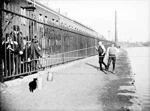 Towpath Prints: Boys fishing across a canal towpath, London, c1905