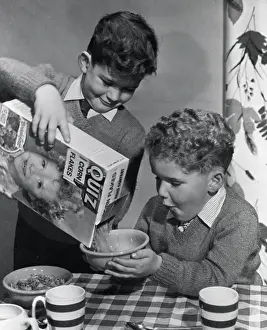 Anticipation Prints: Two boys having a bowl of Quiz Corn Flakes, c1955. Creator: Arthur Charles Kirby Ware