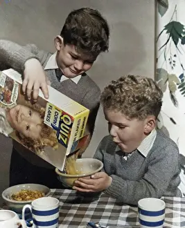 Anticipation Prints: Two boys having a bowl of Quiz Corn Flakes, c1955. Creator: Arthur Charles Kirby Ware