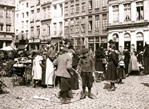 Zuid Holland Prints: Boys with hoops at a market, Rotterdam, 1898. Artist: James Batkin